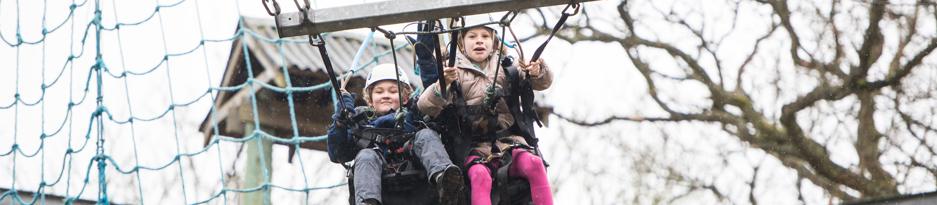 Two young people on a 3G swing 