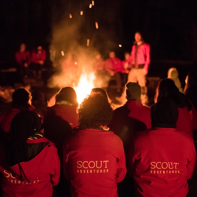 Instructors around a large camp fire