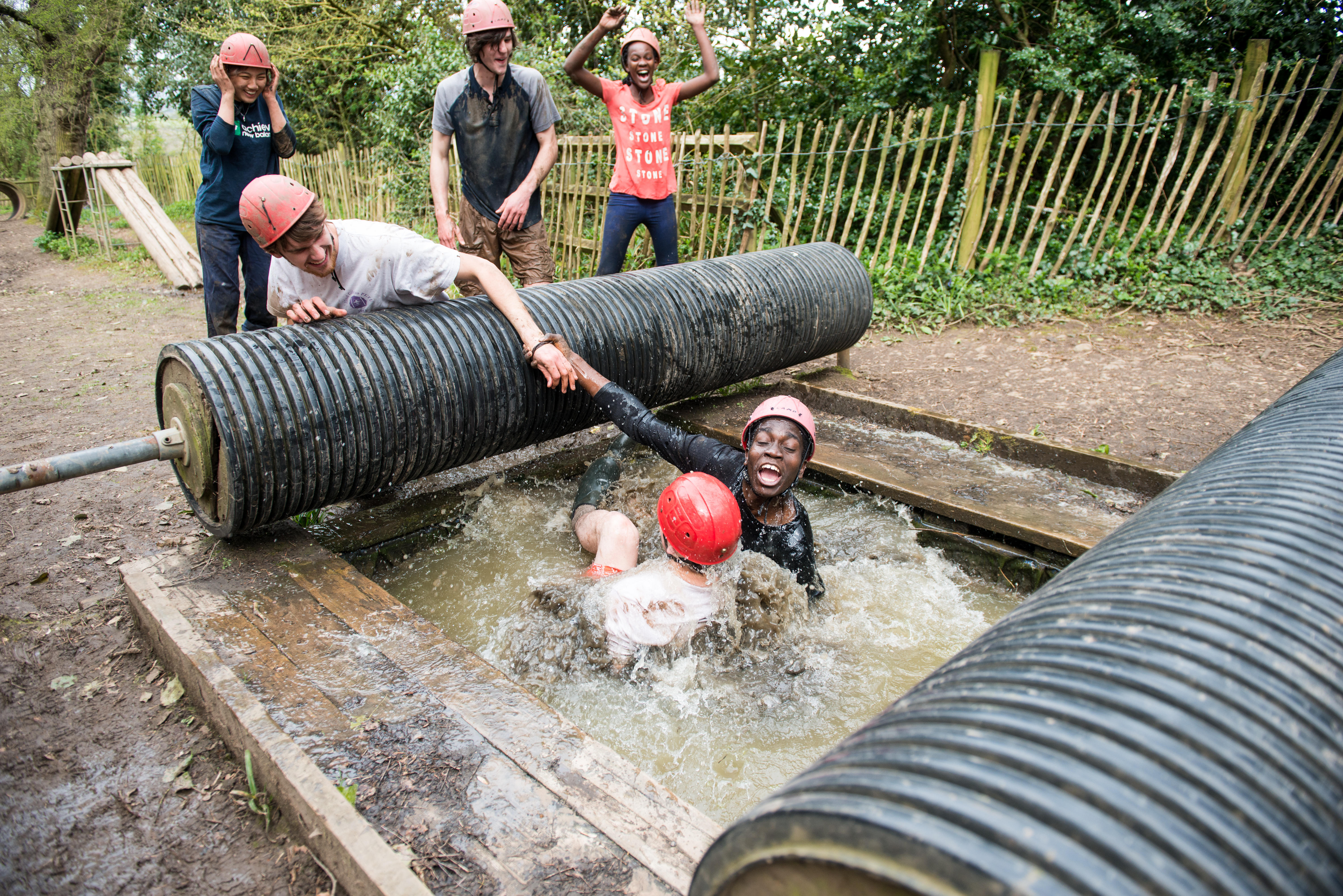 Young people taking on an adventure course