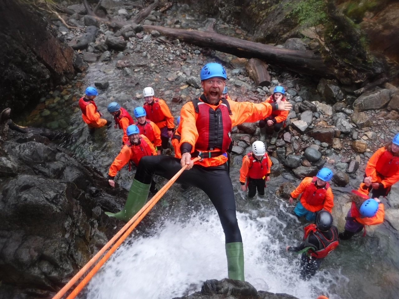 A group of people taking part in Ghyll scrambling