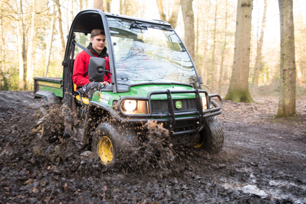 volunteer driving a gator